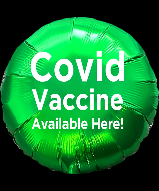 Mylar balloon with text written - covid vaccine available here.
